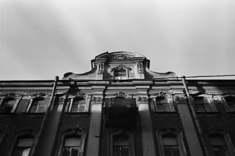 an old building that looks really old and it has very thin windows