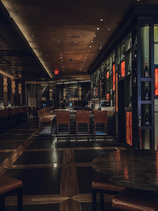 a large wine cellar with seating in front and behind it