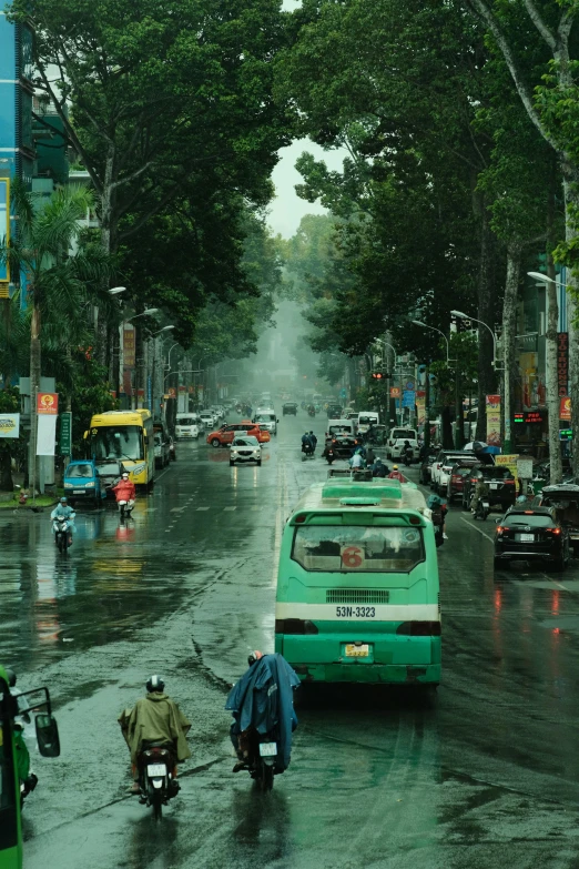 people are standing on the street on a rainy day