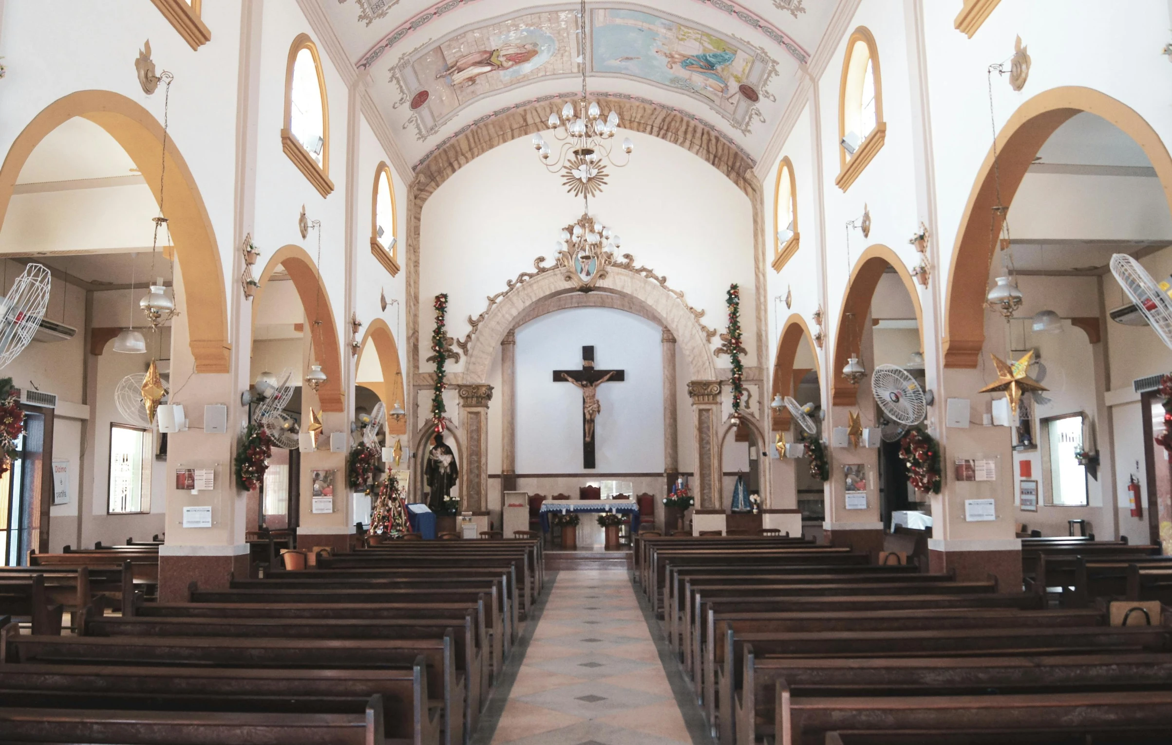 an empty church has pews with chairs in it