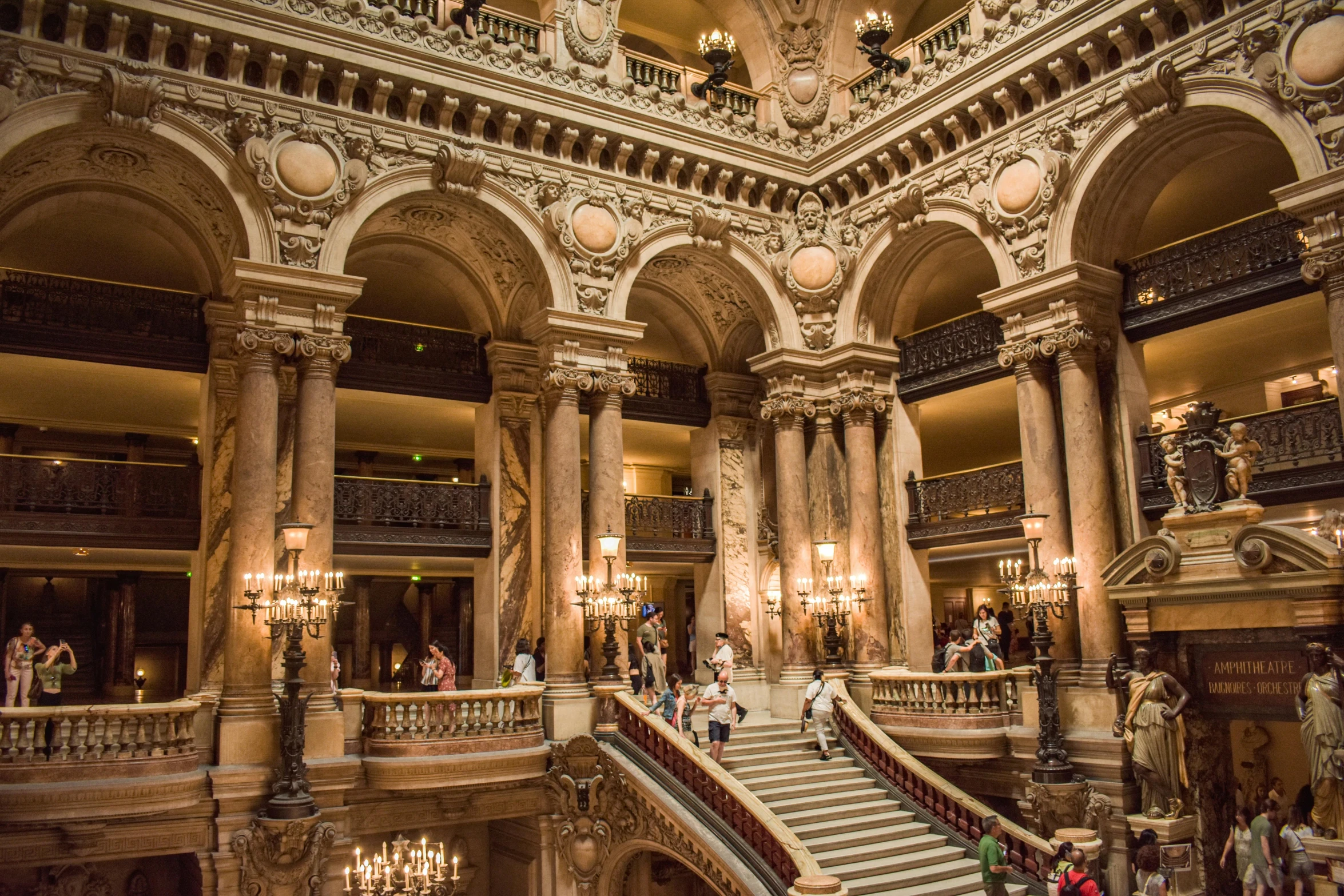 an old building has many large chandeliers and pillars