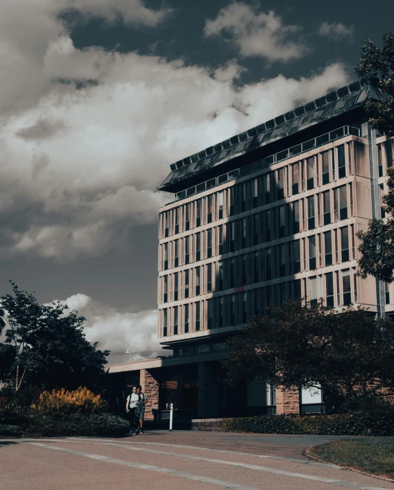 an office building in a city with a dark sky