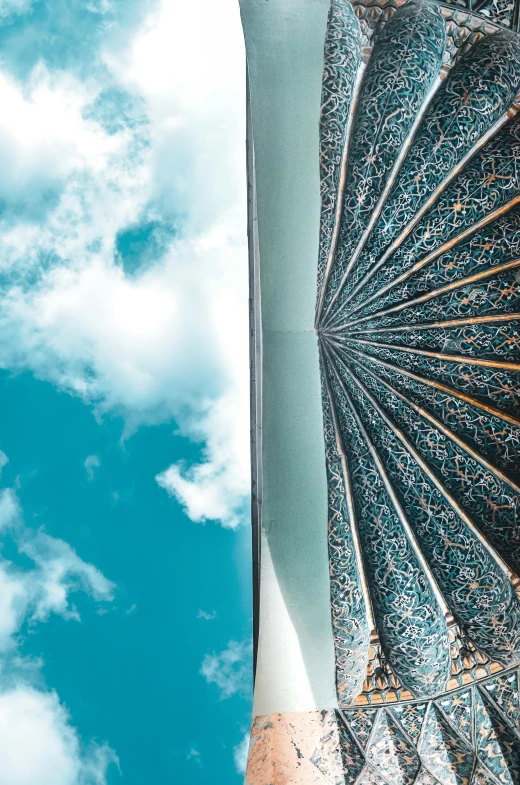 the inside of an umbrella with lots of blue and white designs on it