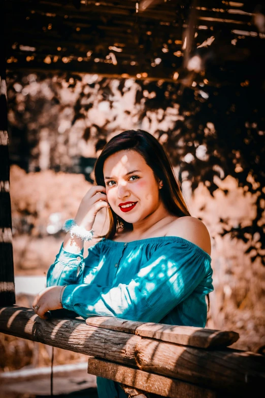 a girl with a phone is posing for the camera