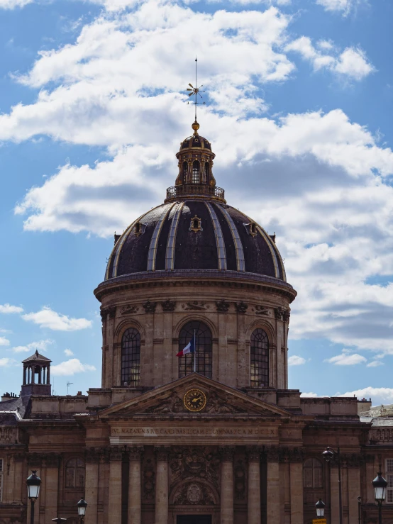 a very large dome with an interesting clock on top