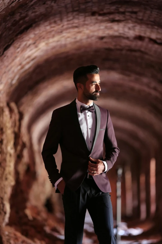 a man with a beard in a tuxedo and bow tie