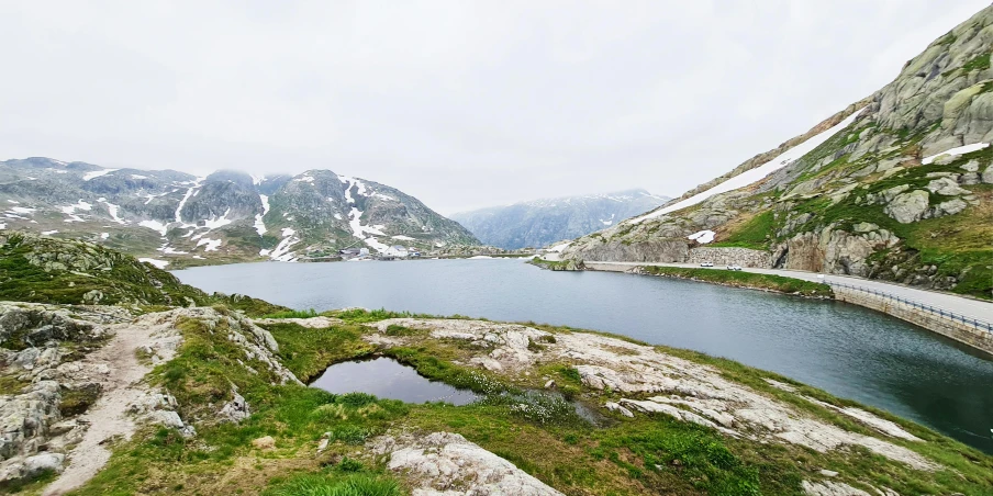 some mountains that are covered with snow and grass