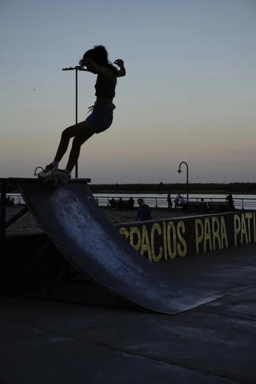a person riding a skateboard down a metal ramp