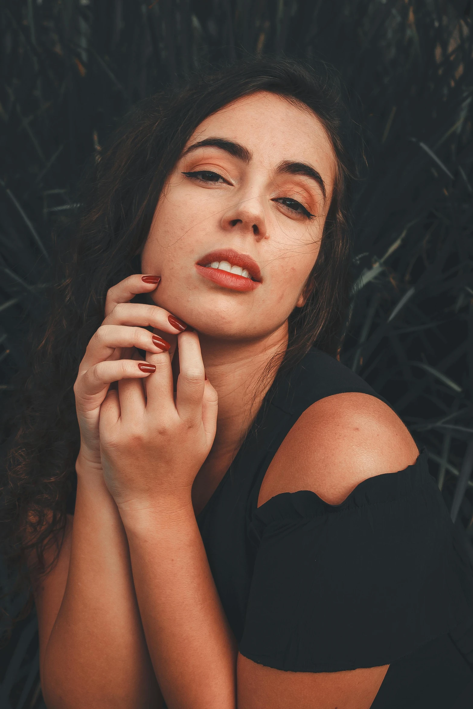 a beautiful young woman in a black shirt is posing for the camera