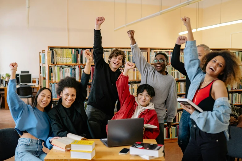 people in a liry raising their arms in the air