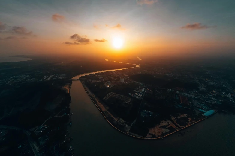 an aerial view of the city at sunrise or sunset