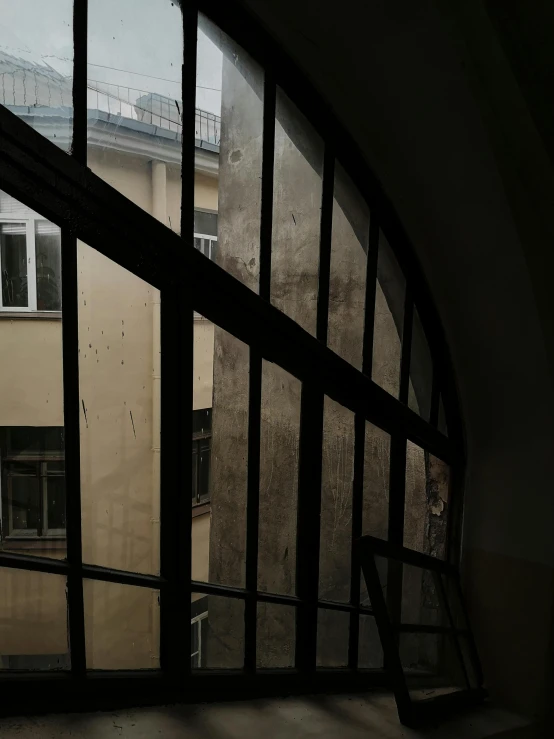 an arched window with a sky view from inside