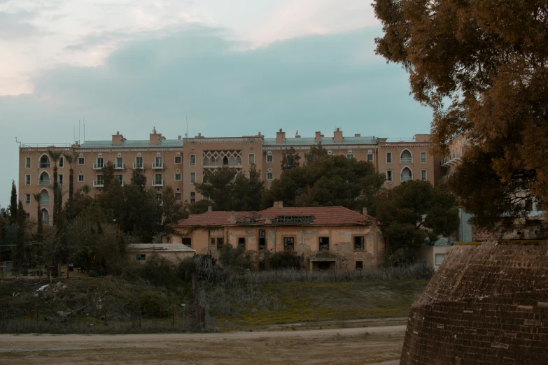 a big brick building with some trees outside of it