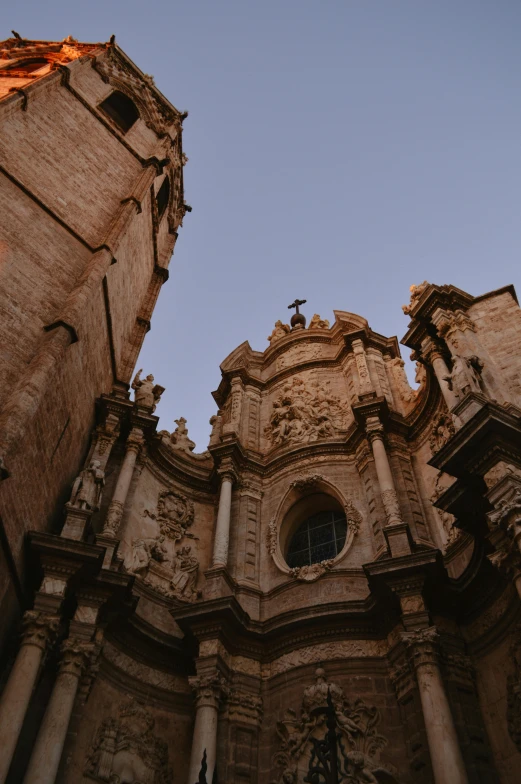 a tall church with tall windows and lots of spires