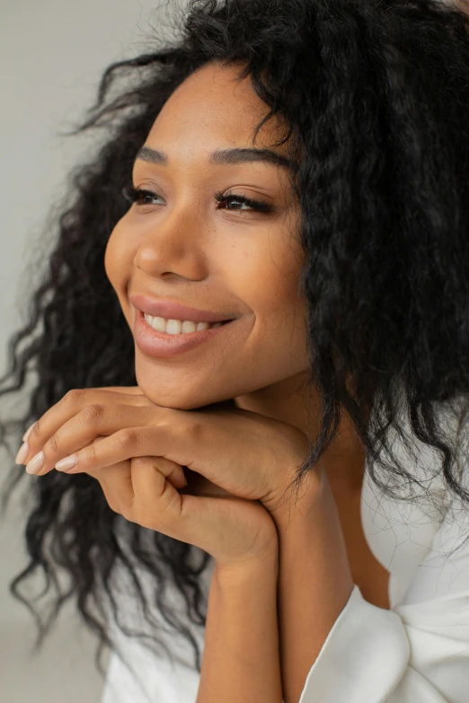 a pretty young woman with long hair and a smile