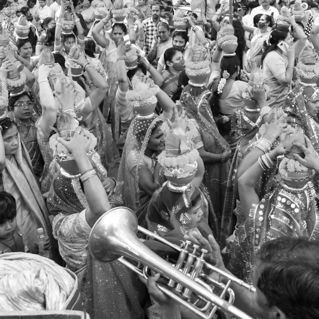 a large group of women are dancing in different costumes