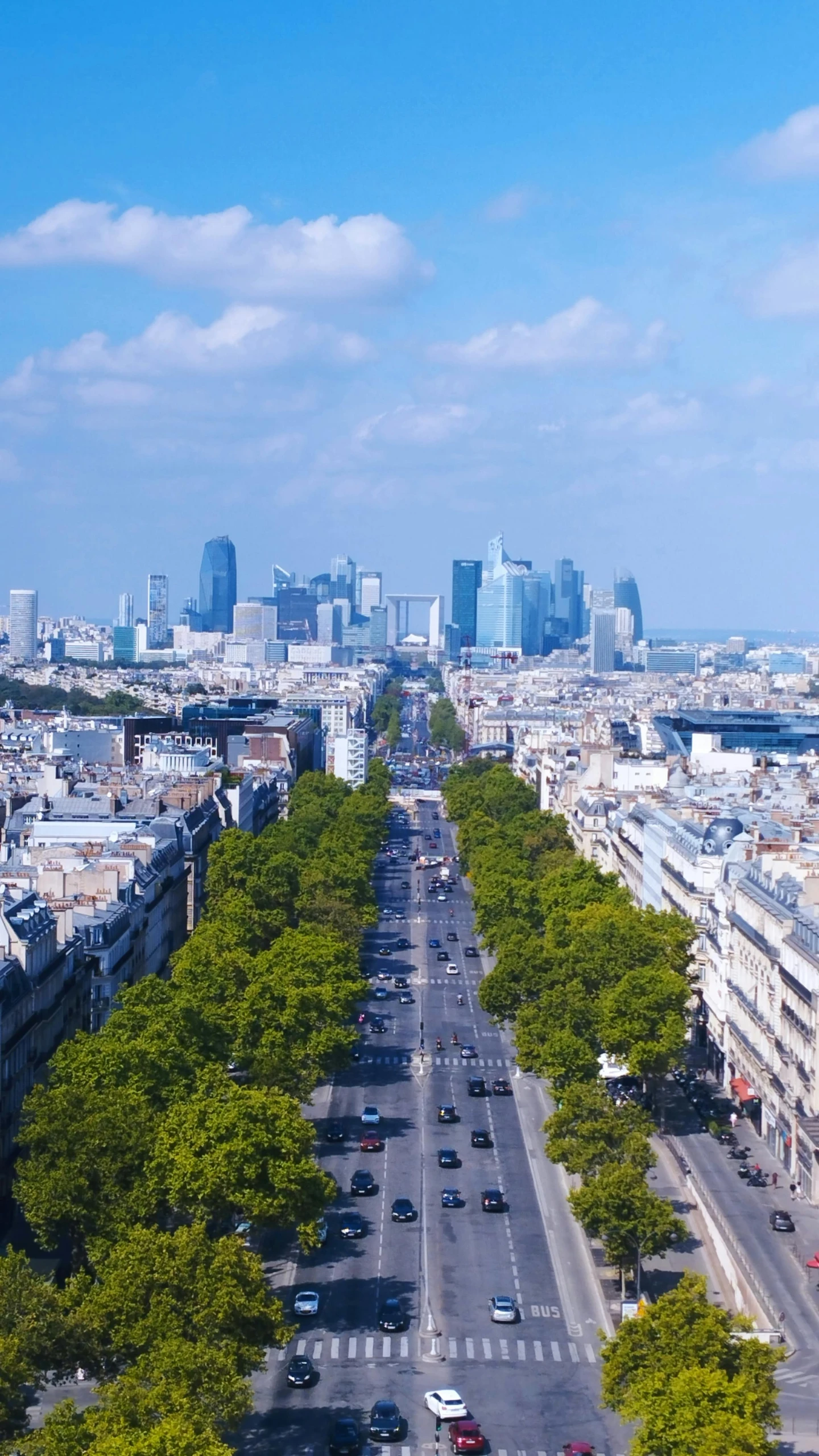 looking down an empty, wide road in the city