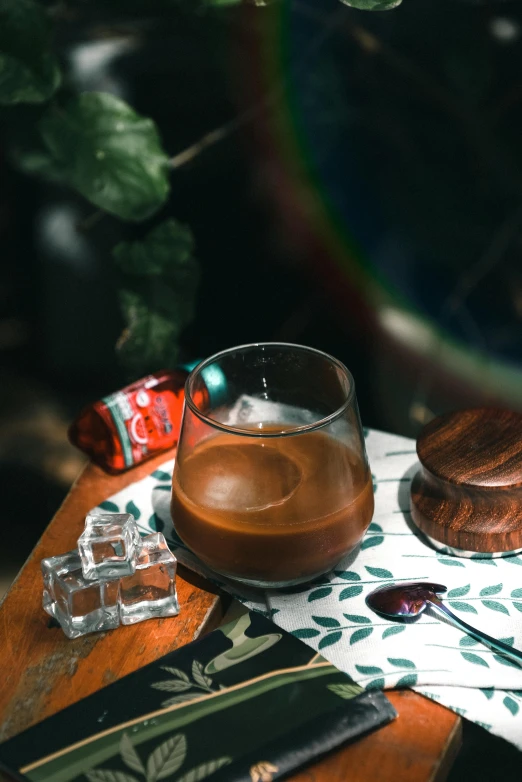 a wooden table topped with glasses, a napkin and other items