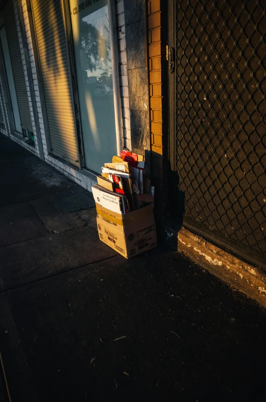 a cardboard box full of boxes in front of a door