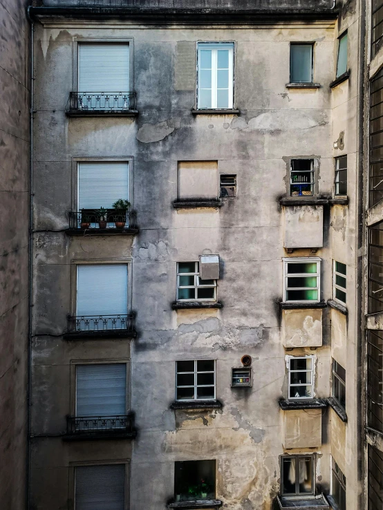 an old building with lots of windows, balcony and other windows