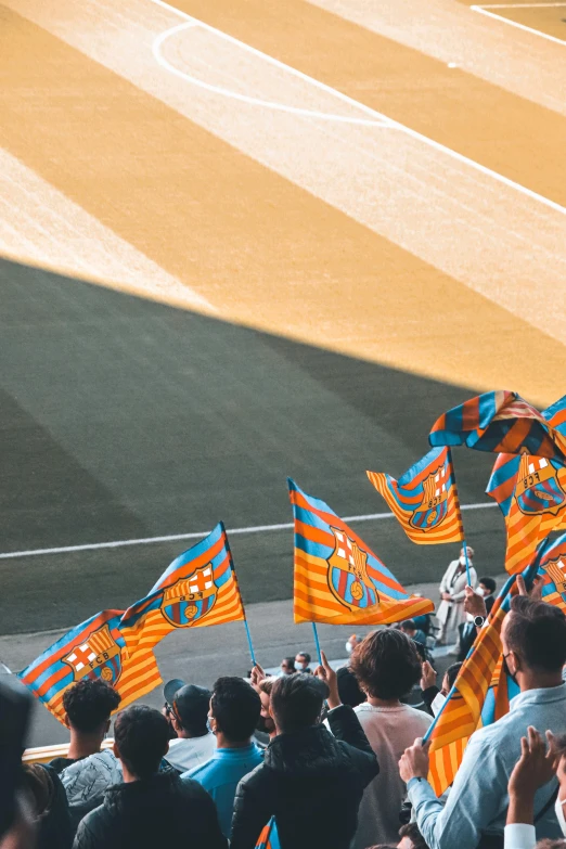 the teams in their dugout have flags on their hands