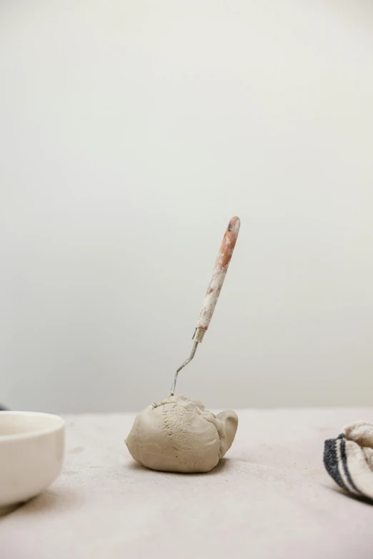 an old teapot pouring water into a teacup