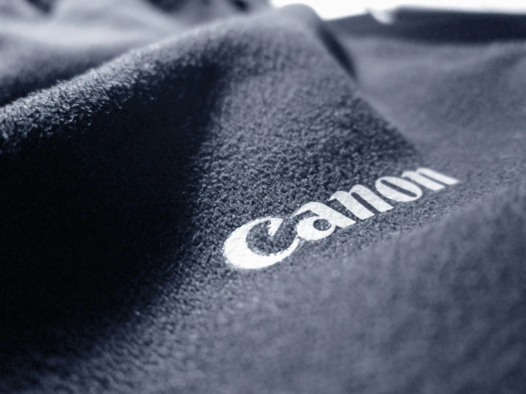 a canon shirt that is sitting on the table