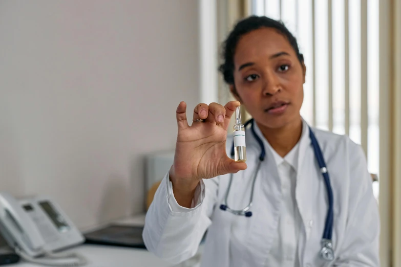 a person that is wearing a white lab coat