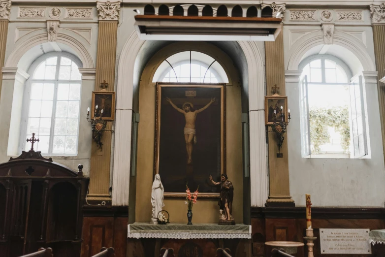 a statue of jesus  on the cross in a church