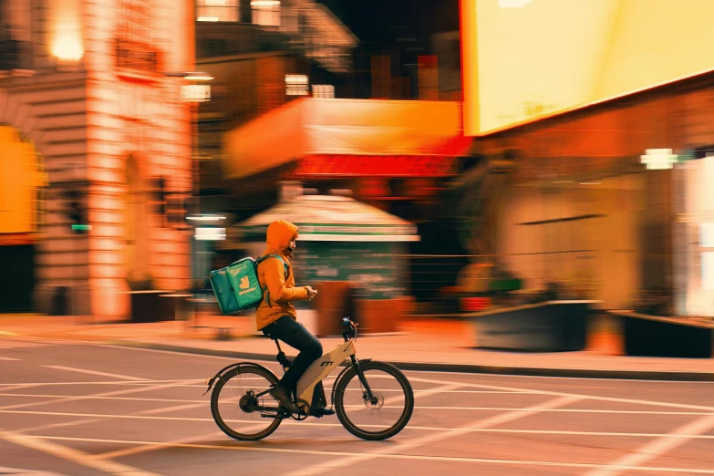 a woman riding a bike in the middle of the street