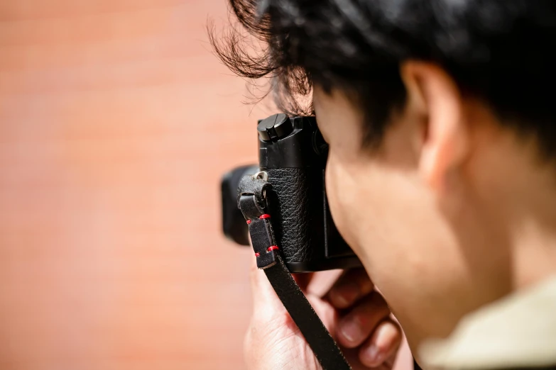 a man taking a picture of someone holding a camera