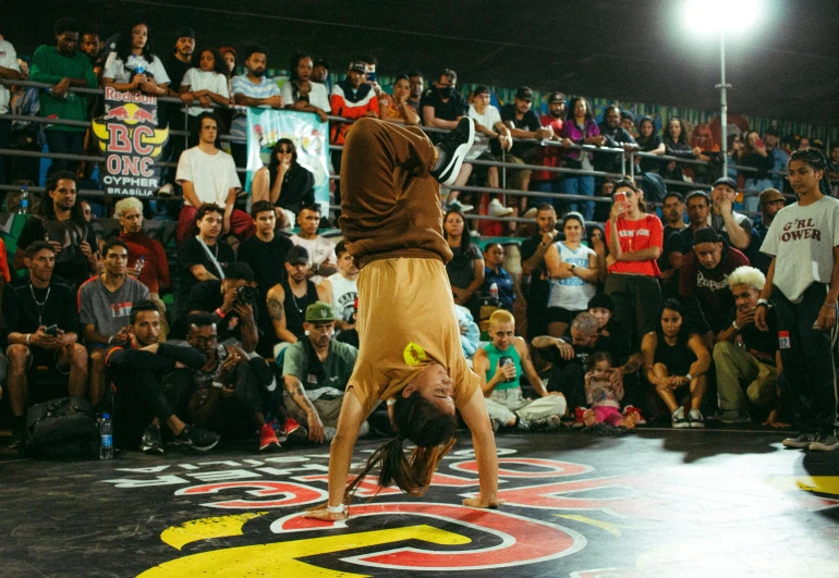 a man doing tricks on a skateboard at a show