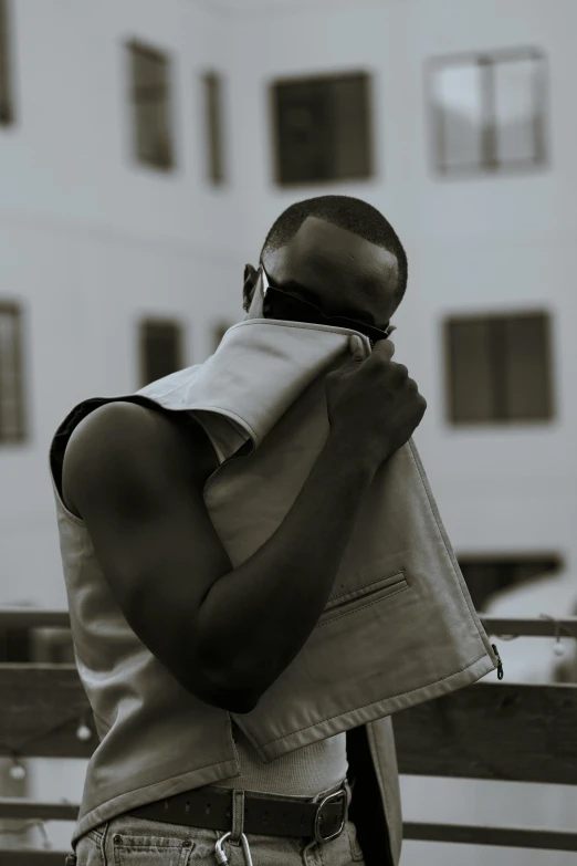 an image of black guy carrying his helmet