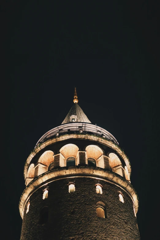 the top of a tall tower in a night sky