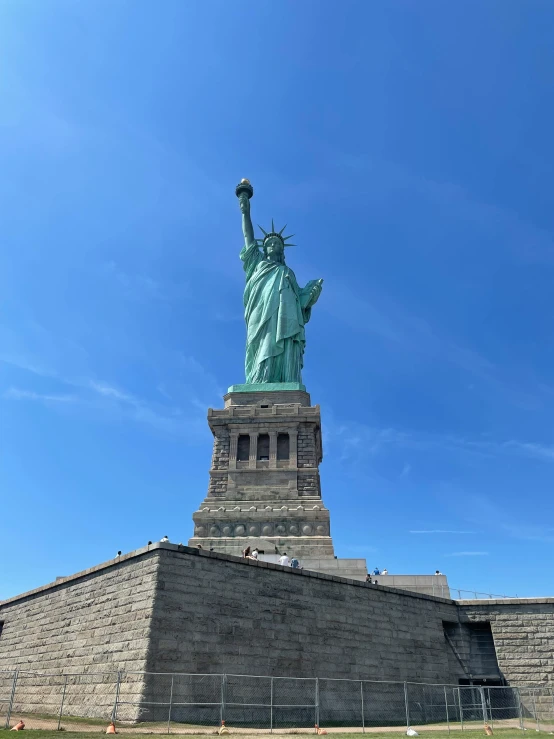 the statue of liberty is surrounded by some brick