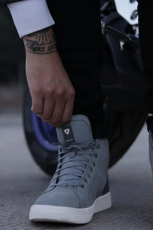 a close - up of a foot with tattoo on his arm