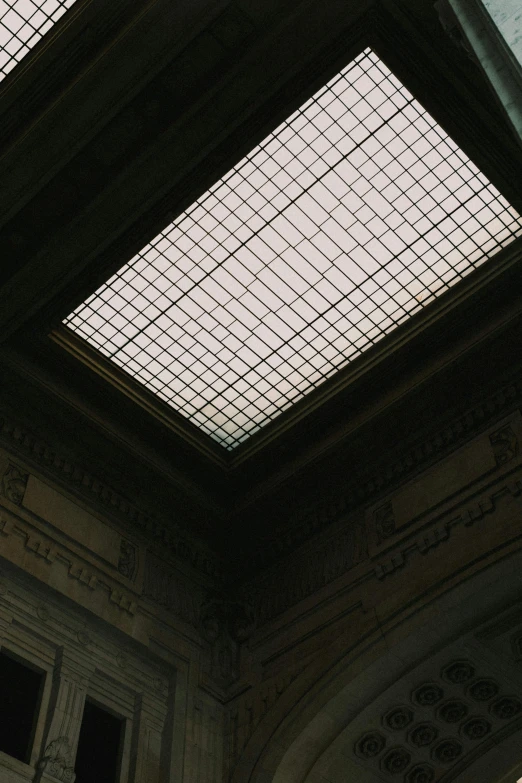 a large glass skylight in a very large building