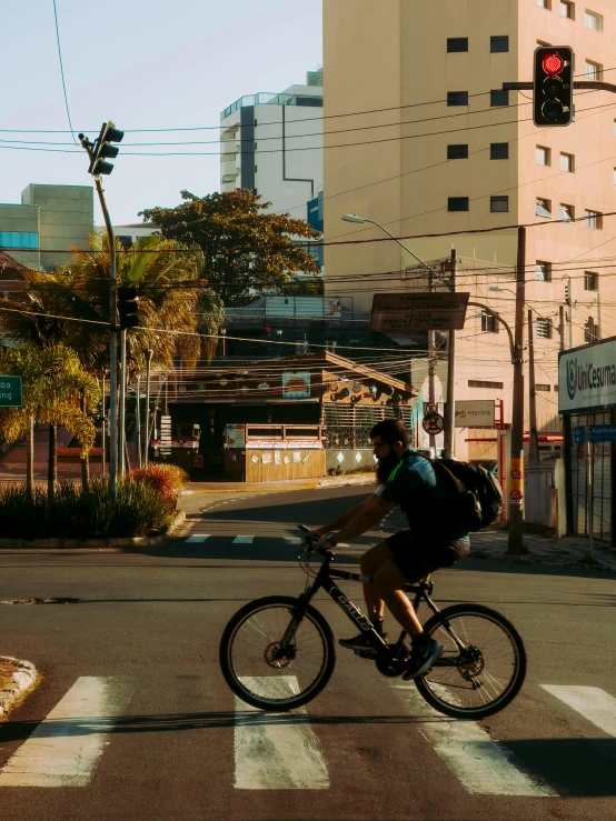 a man rides his bike through the city