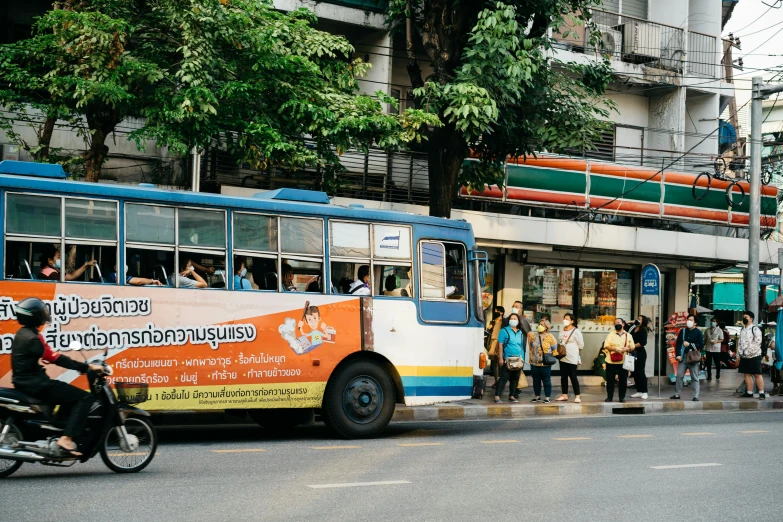 a colorful bus driving down a city street