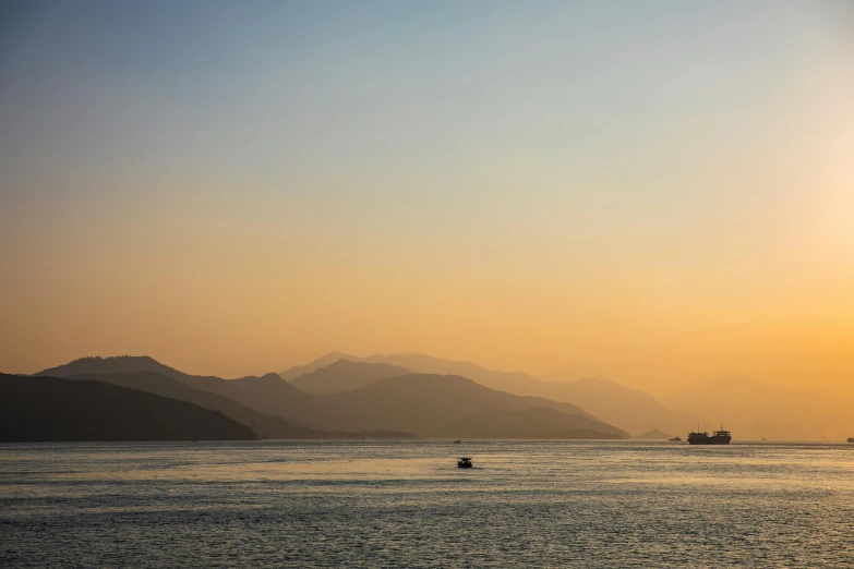 a body of water with boats in the distance