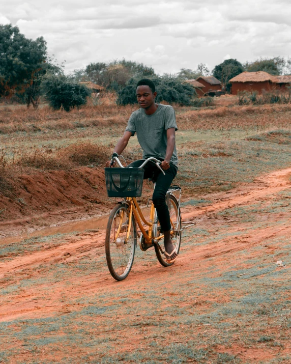 a man that is sitting on the back of a bike