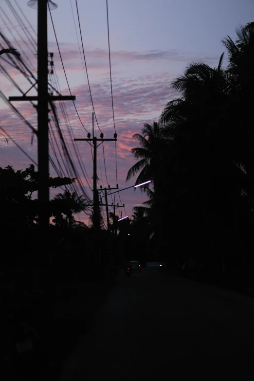 an image of a street with the sky going purple