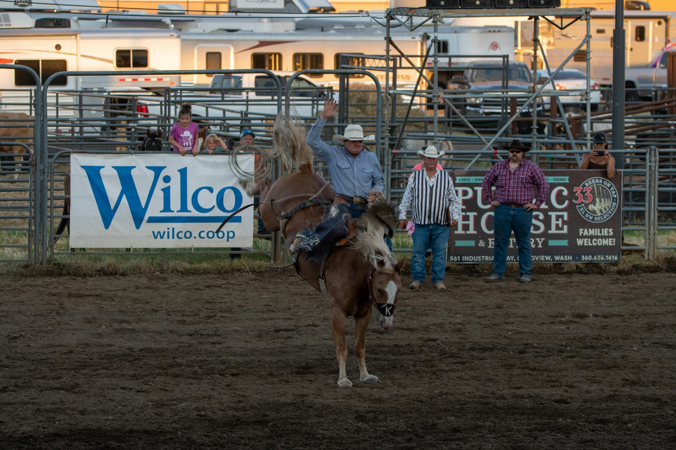 a man is riding on a horse at the rodeo