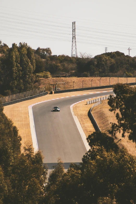 a road winding with a car in it