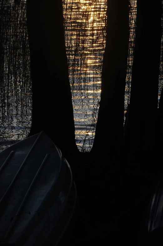 a small boat is in the dark water