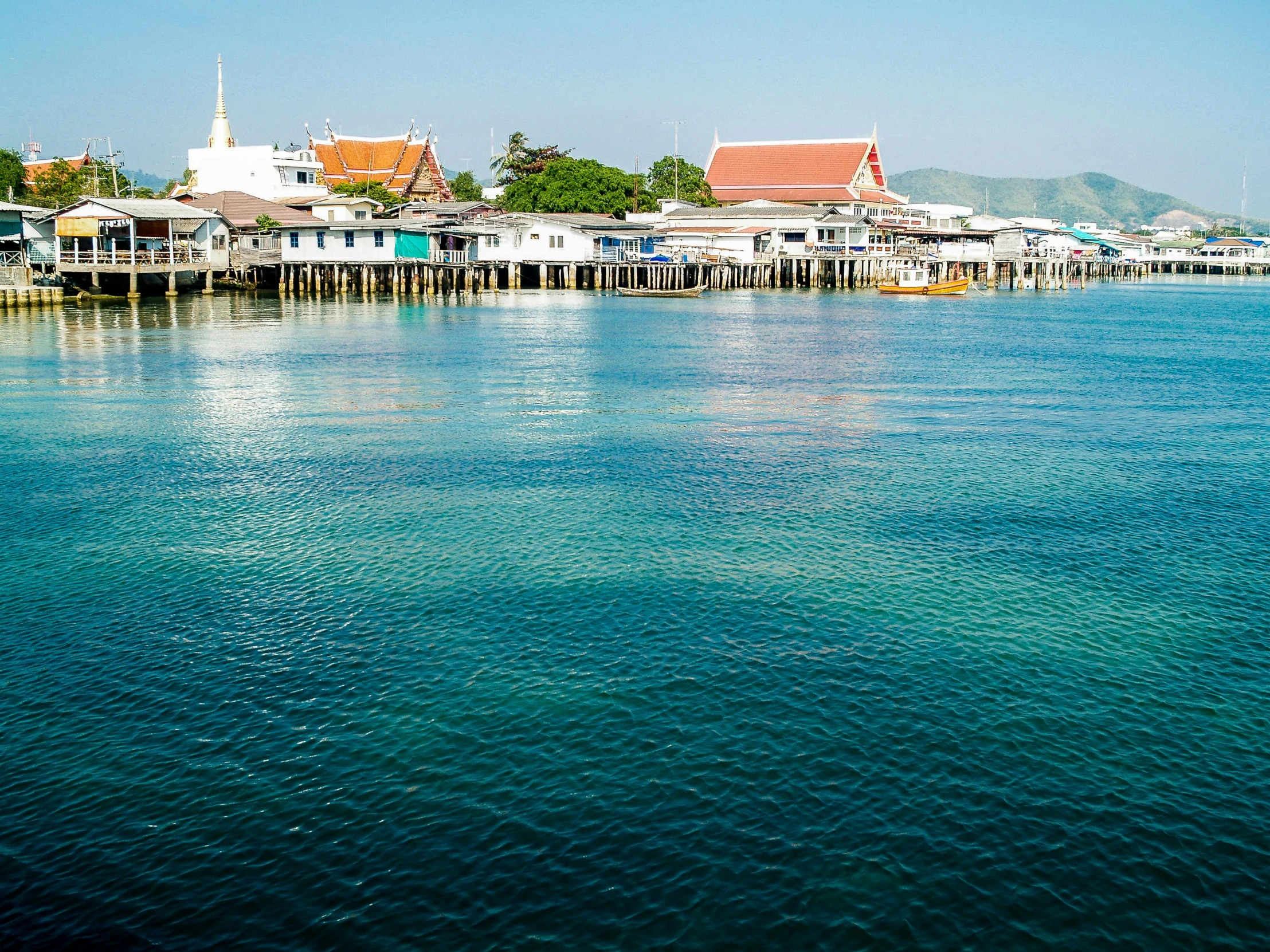 houses are perched on stilts in the water