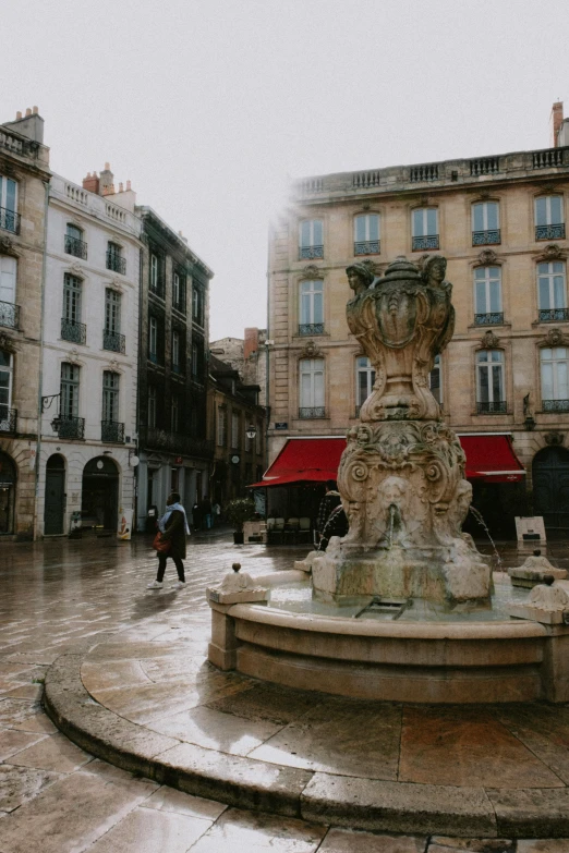 a square with a statue on the top of it