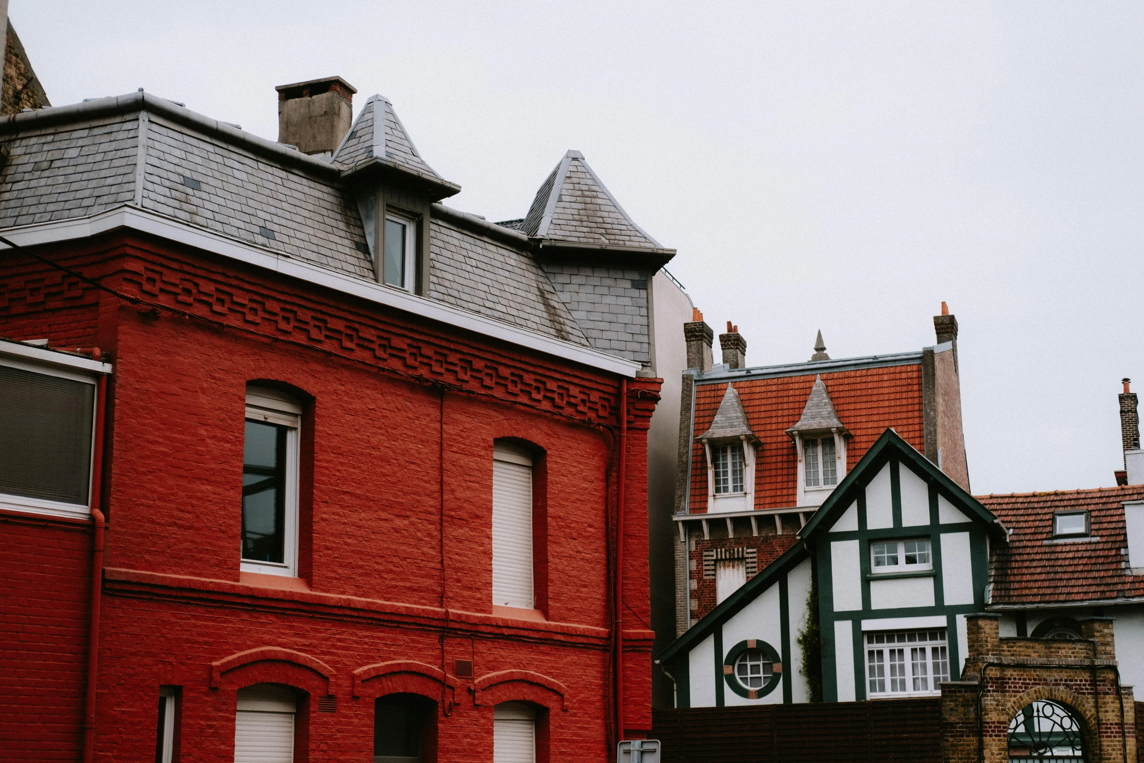 some buildings that are red, green and white