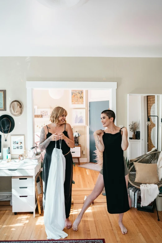 two women who are standing in the room