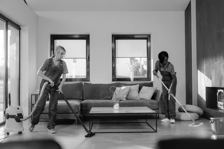 two women in the living room with their mop